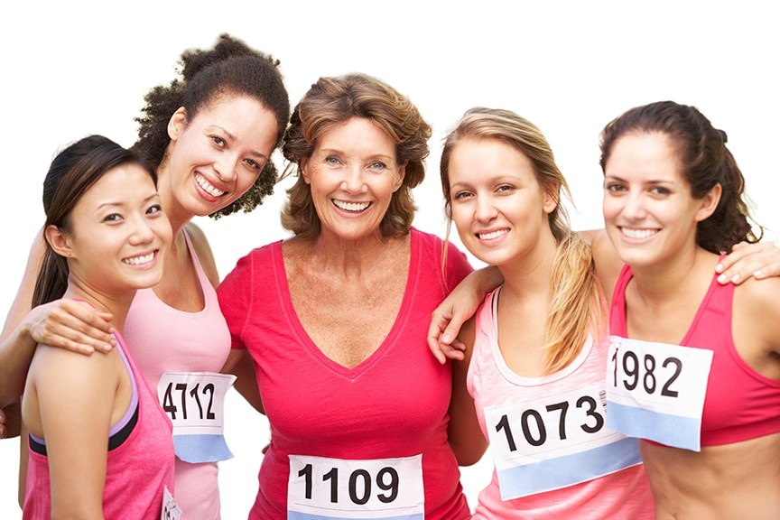 5 women in race with bibs and smiles on