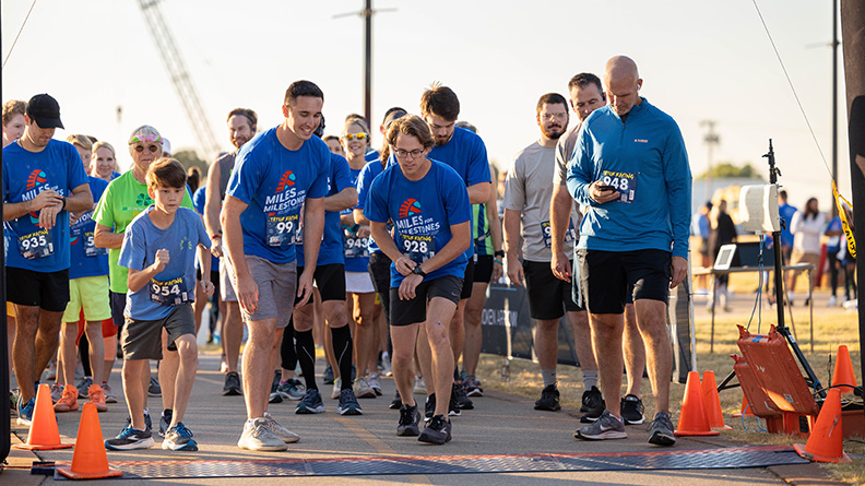 dozens of runners waiting for the the signal to start a charity race