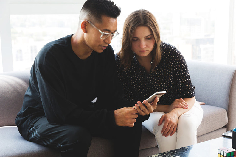 man and woman sitting having a difficult discussion