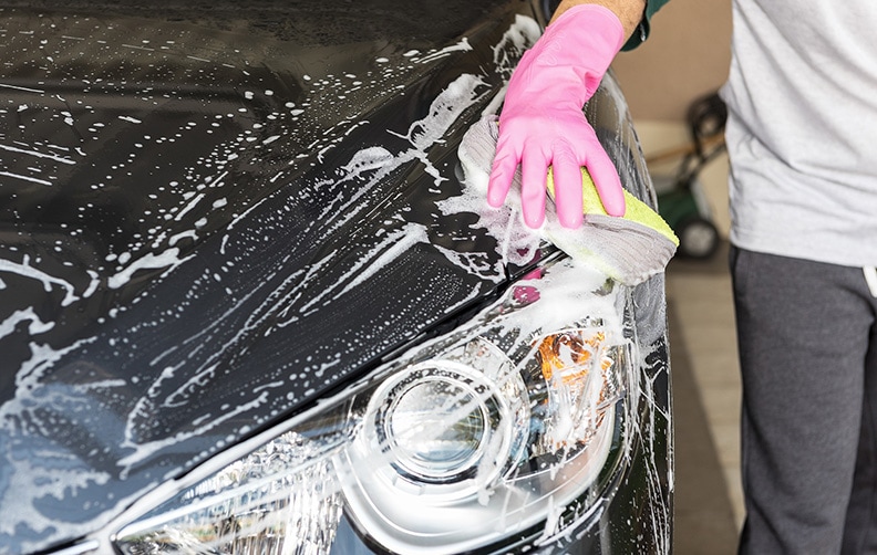 boy washing car