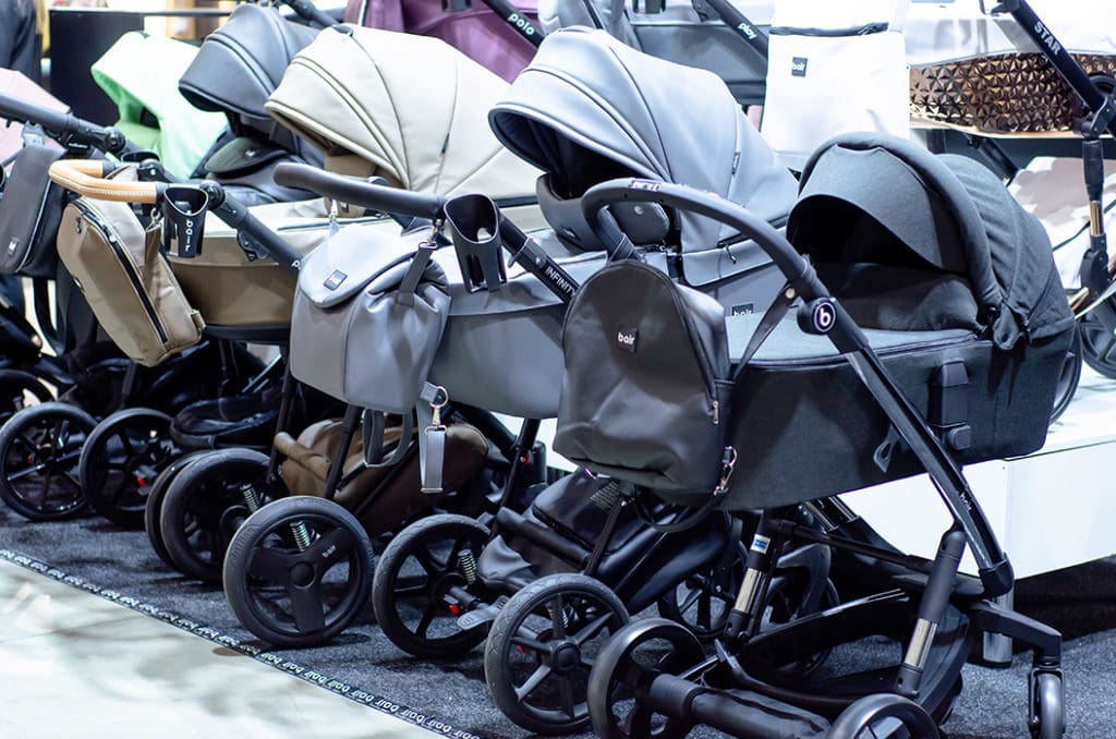 five baby strollers in a row
