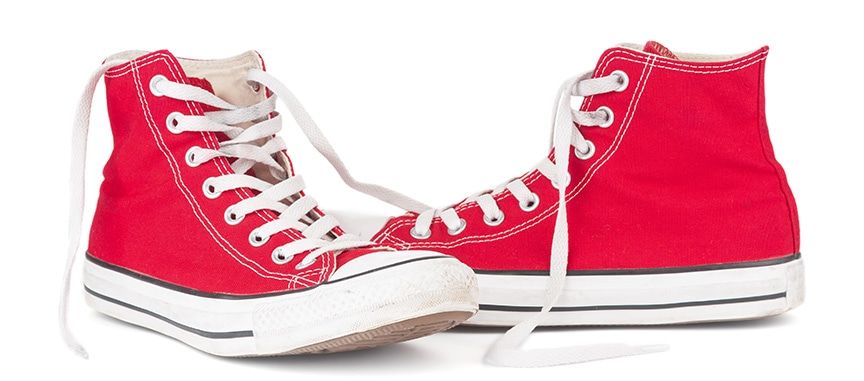red pair of converse hightop sneakers
