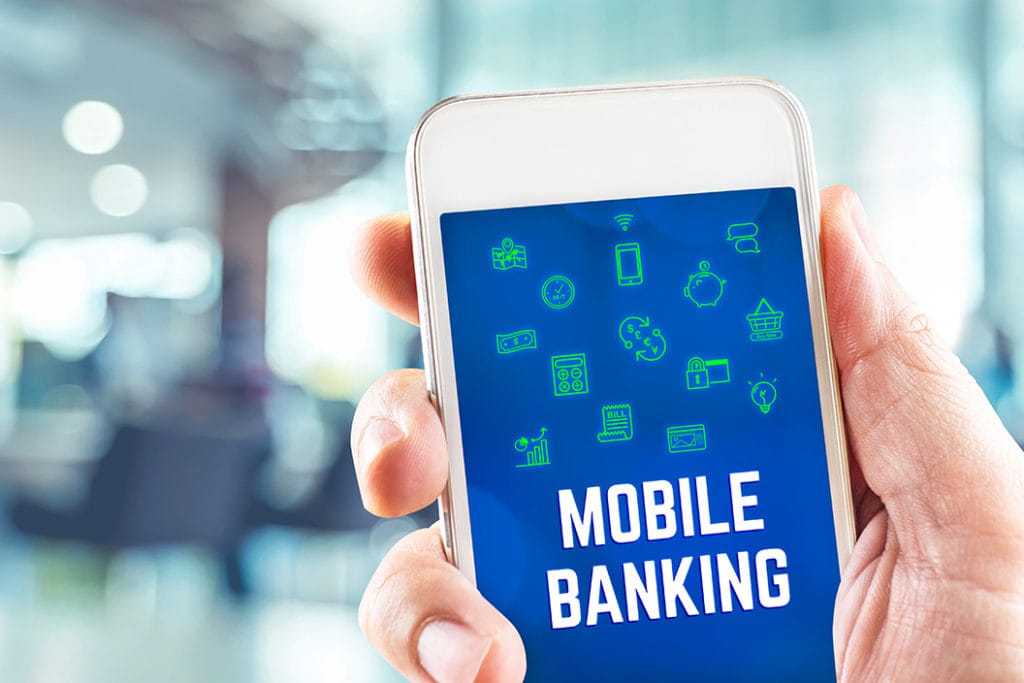 hand with a cell phone in it showing a banking app
