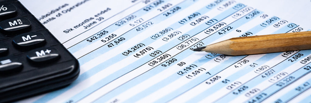 accounting ledger on paper on a desk with pencil tip showing