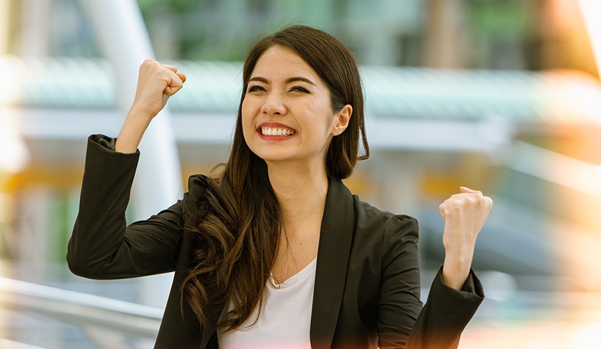 Excited successful business woman smiling and raised hands up ce