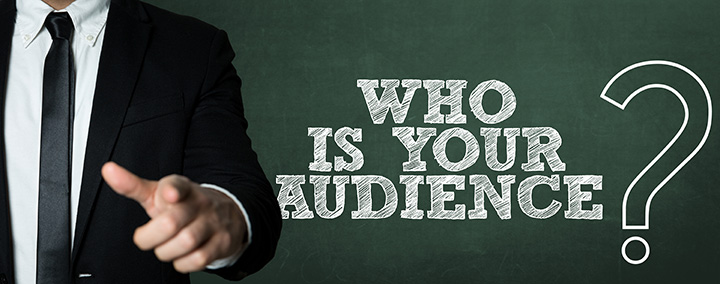 Business man pointing with the text: Who Is Your Audience?