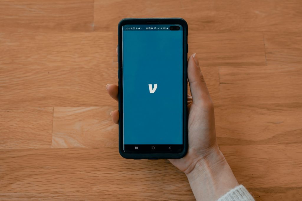 phone showing venmo tech daily unsplash
