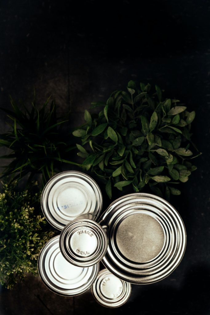blank cans with greenery