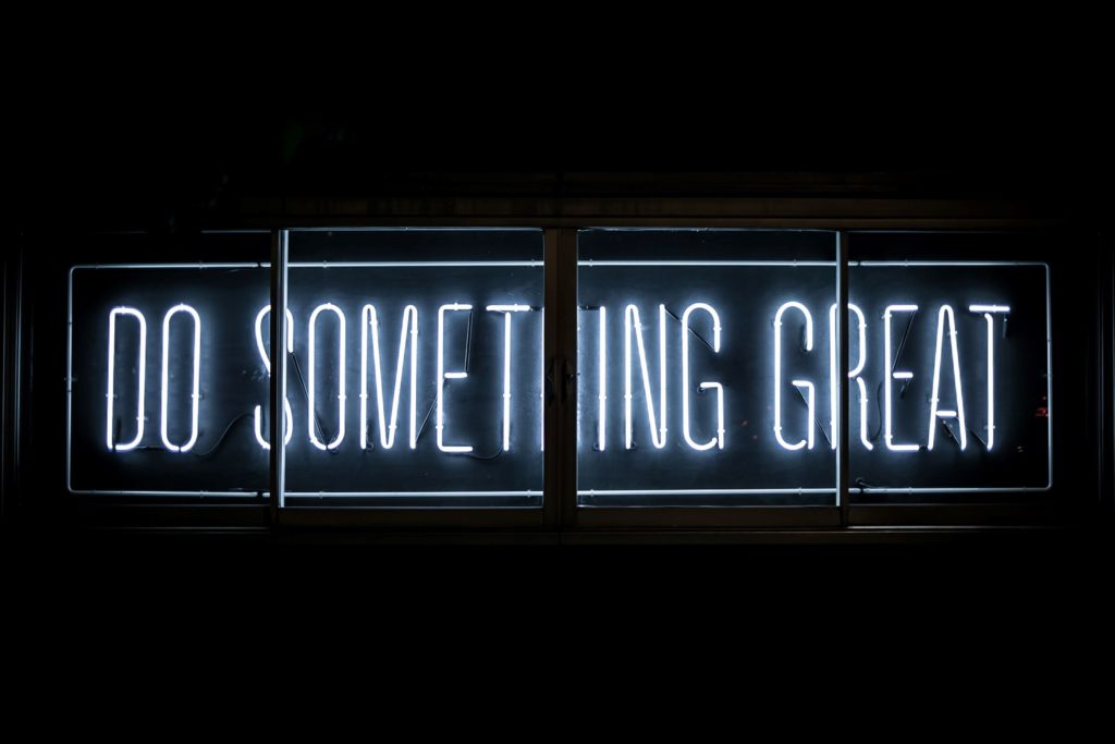 neon sign that says "do something great"