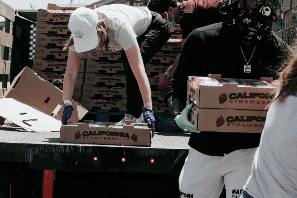 volunteers unloading donated strawberries