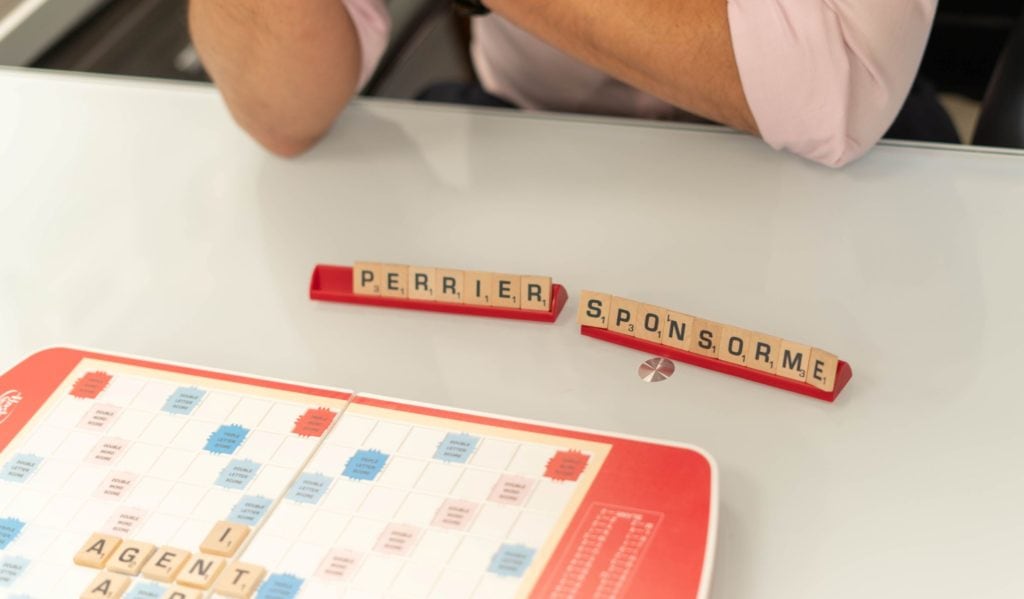 scrabble tiles spell "sponsor me perrier"