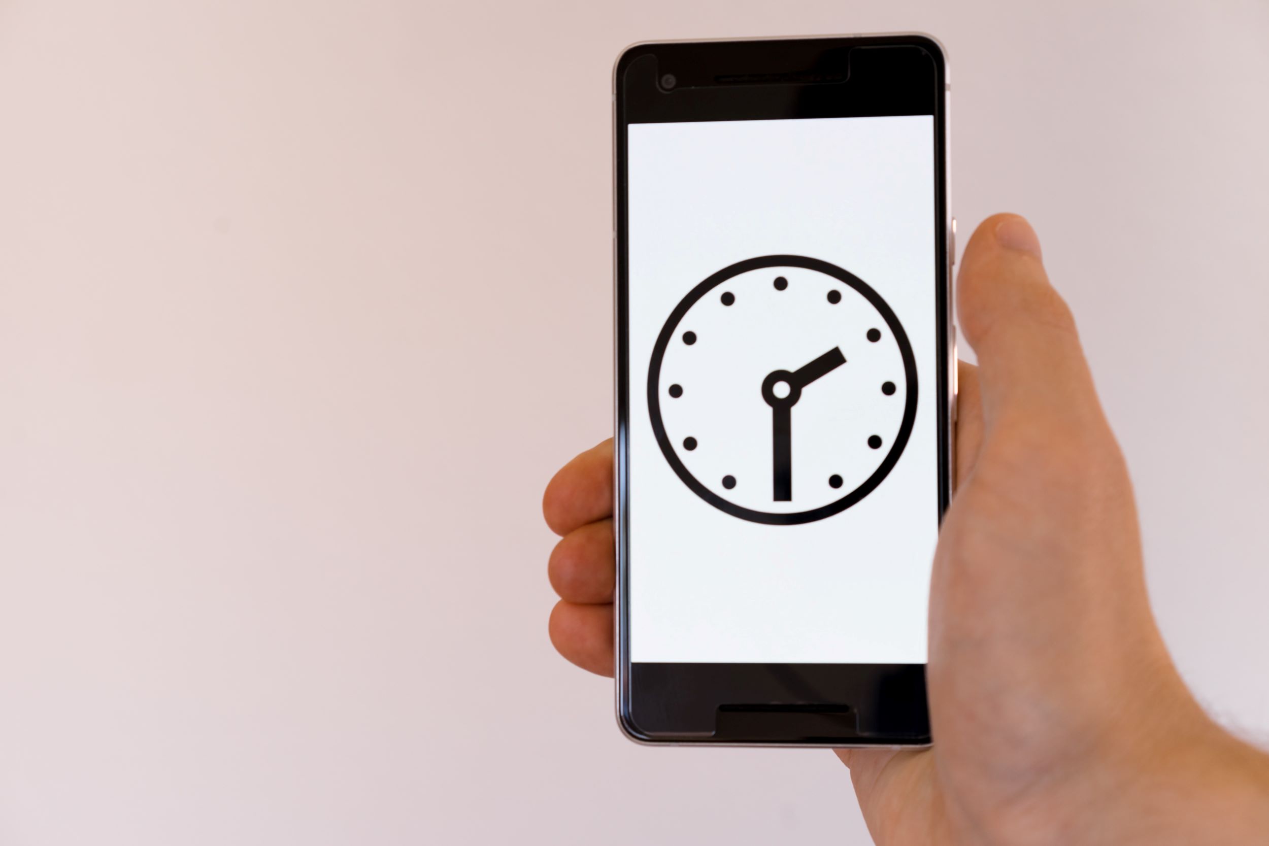 smartphone with clock graphic on screen