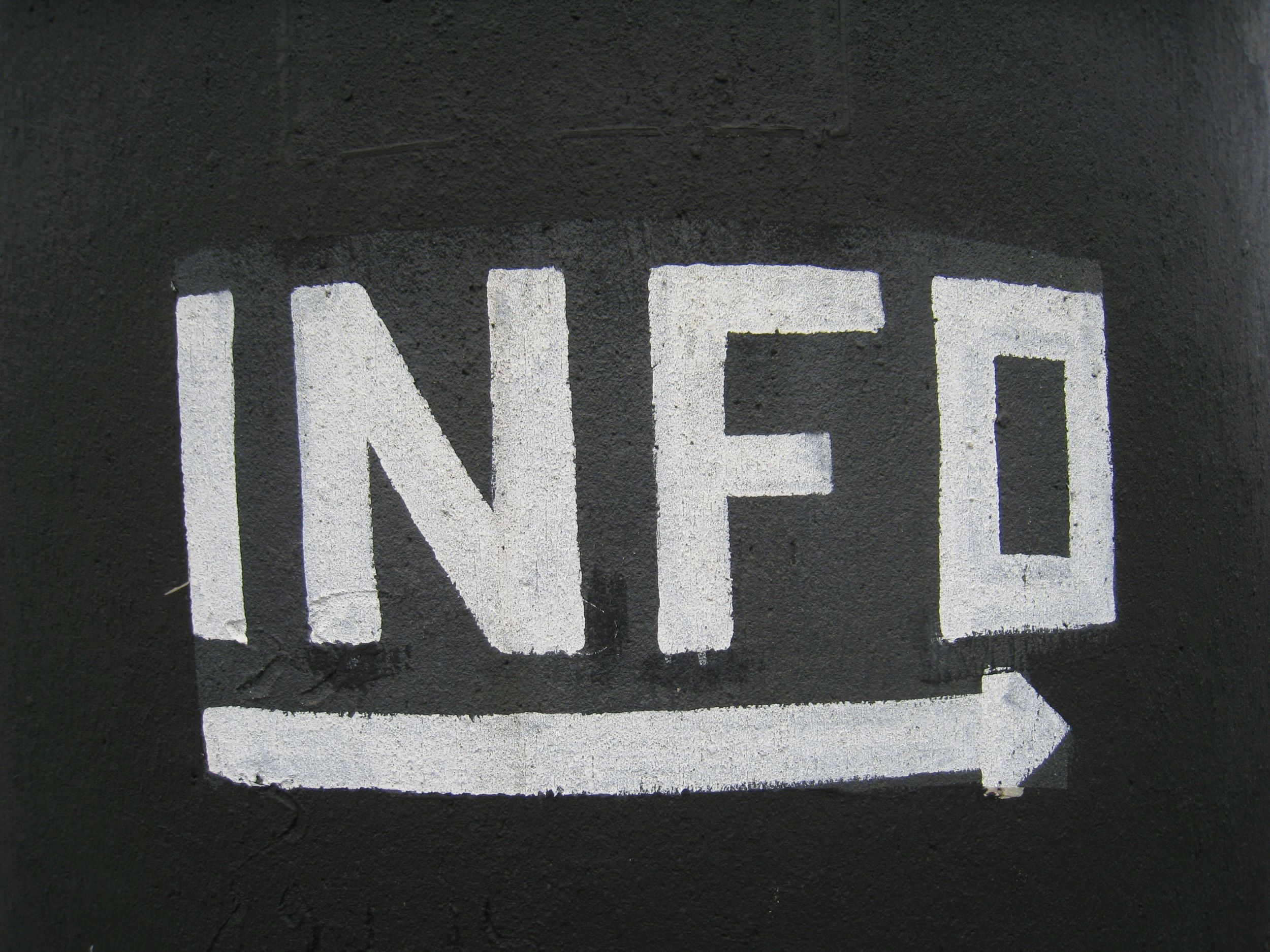painted sign that says "info"