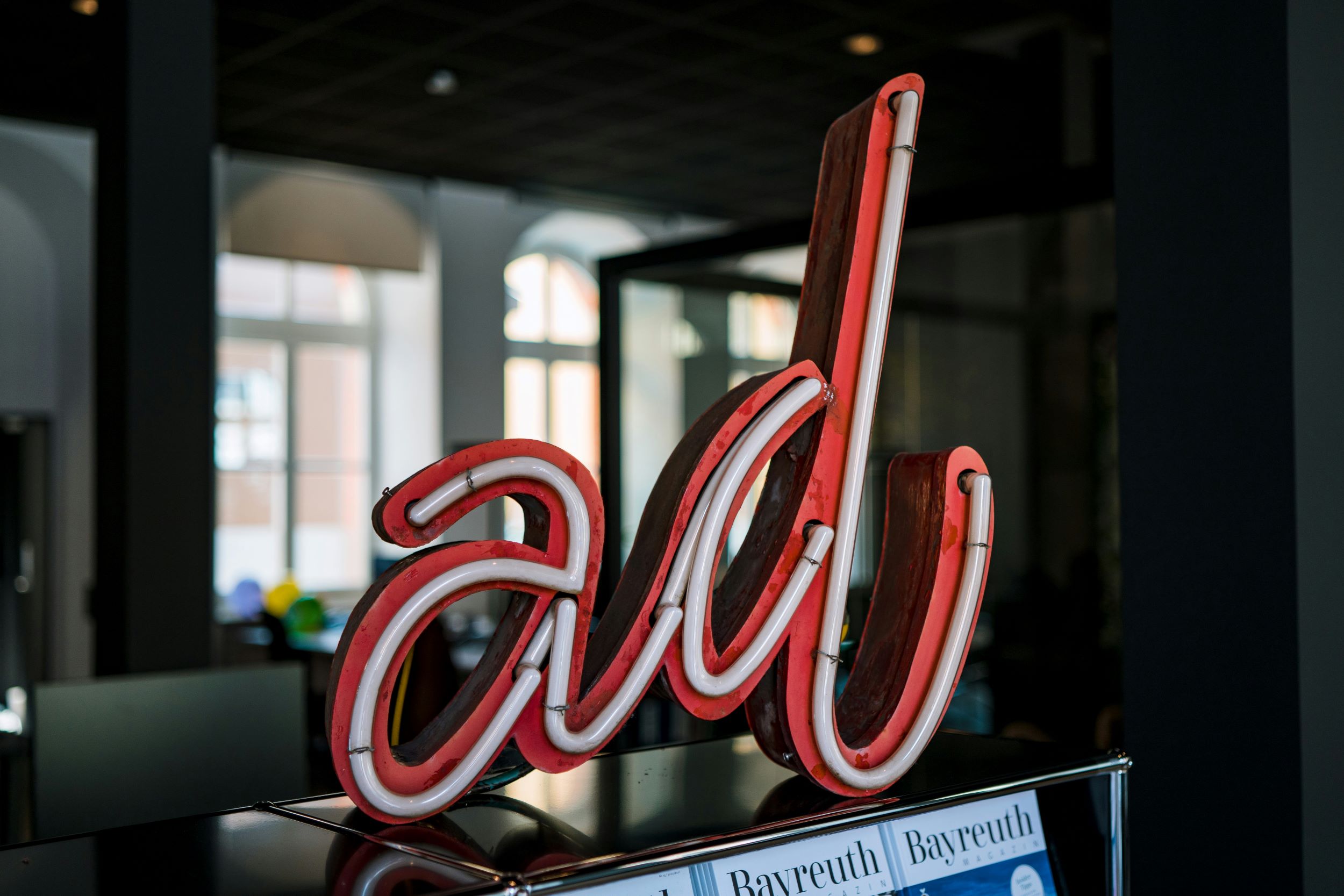 neon sign that says "ad"