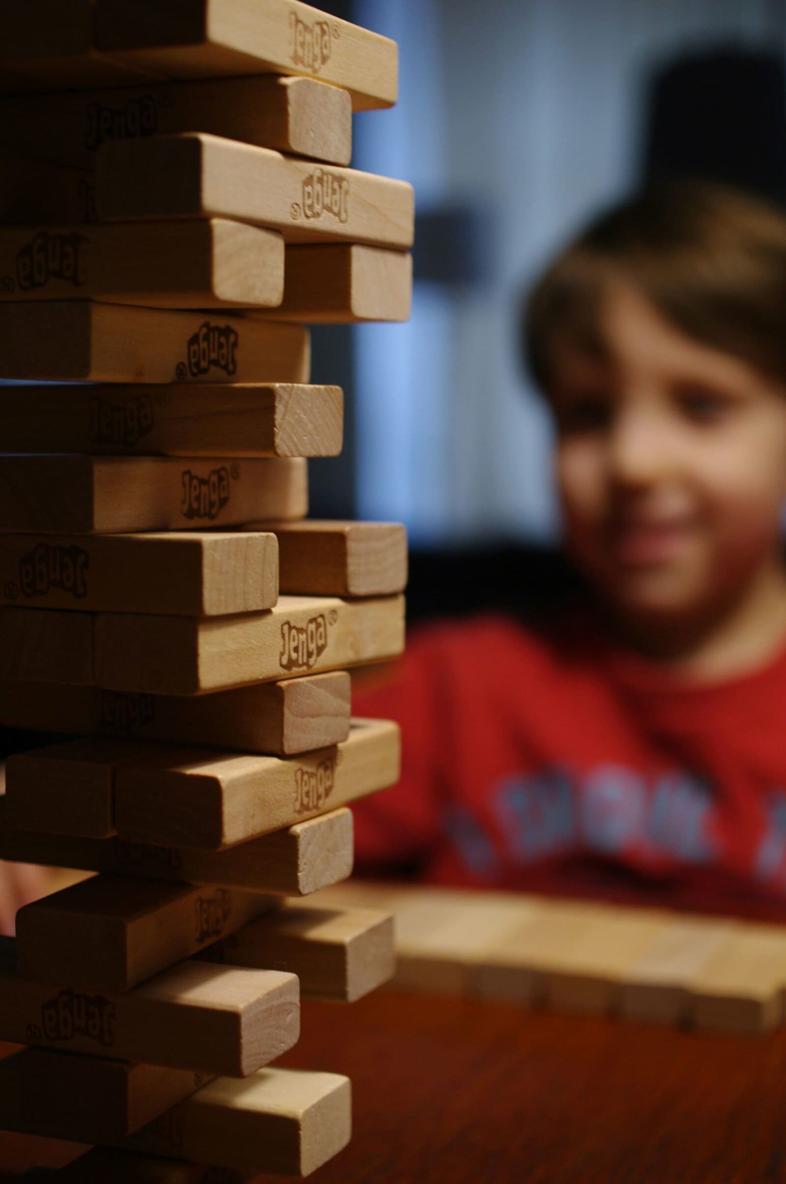 child playing Jenga