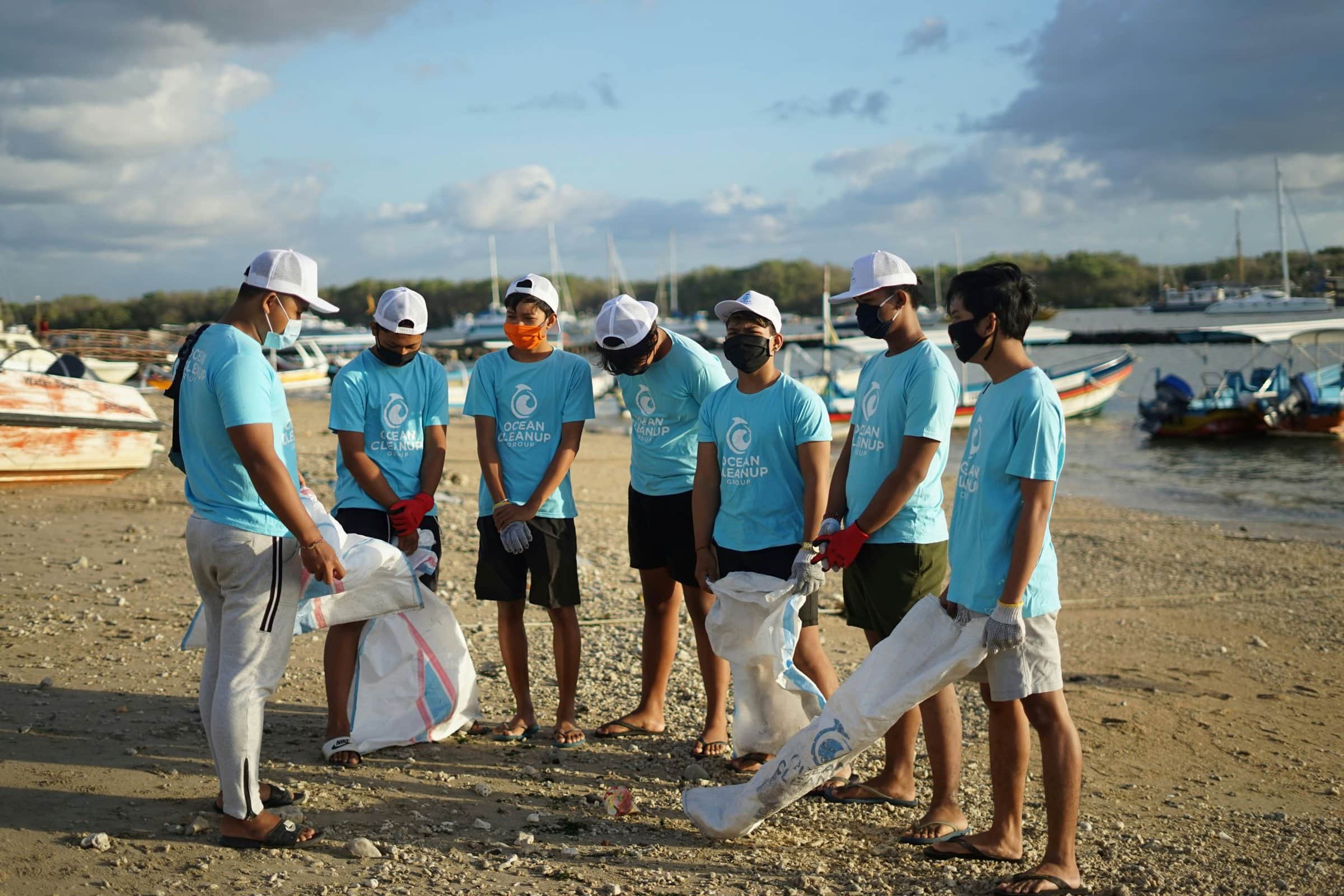 volunteers cleaning up a beach